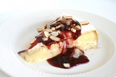 Baked Brie With Cran~Raspberry Sauce and Toasted Almonds